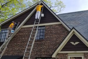 John Monaco's Top of House Being Painted.